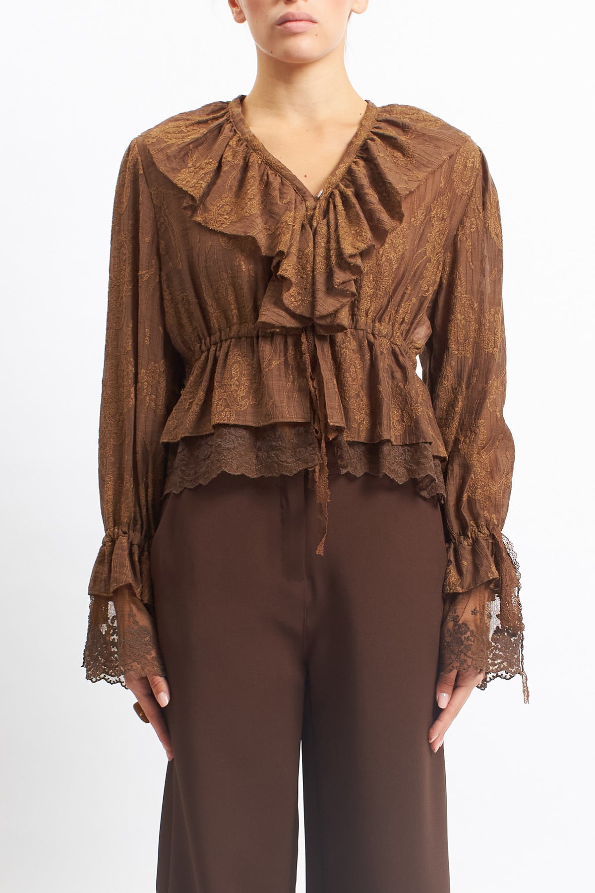 Blusa in pizzo con rouches