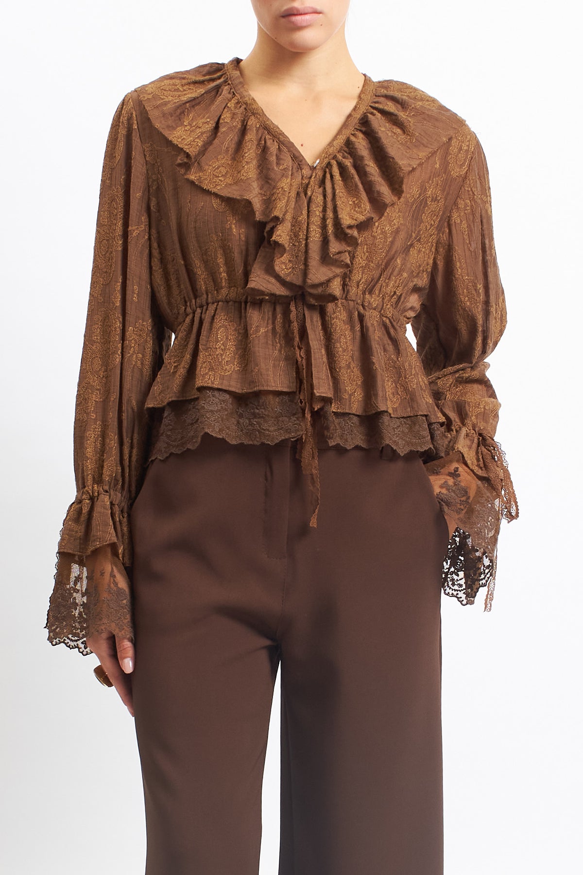 Blusa in pizzo con rouches