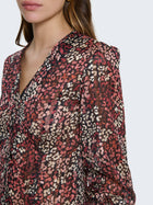 Camicia con filo lamé e maniche a palloncino