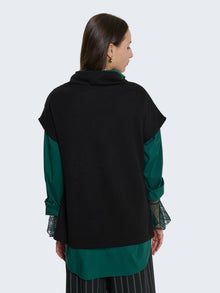 Maglia senza maniche con taglio asimmetrico