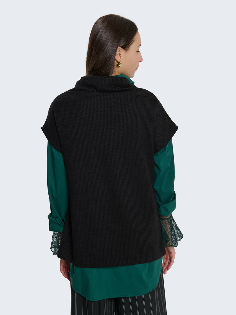 Maglia senza maniche con taglio asimmetrico