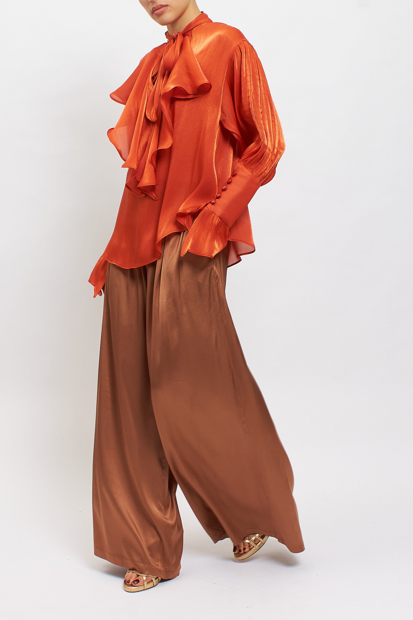 Blusa con fiocco e rouches