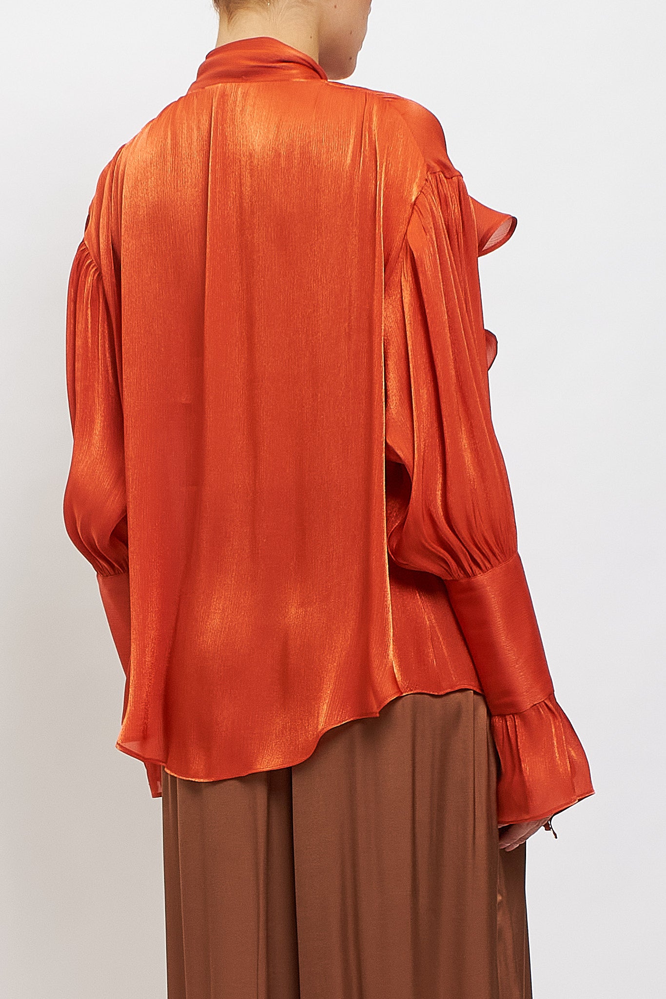 Blusa con fiocco e rouches