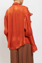 Blusa con fiocco e rouches