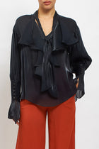 Blusa con fiocco e rouches