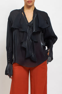 Blusa con fiocco e rouches
