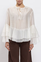 Blusa con maniche volant