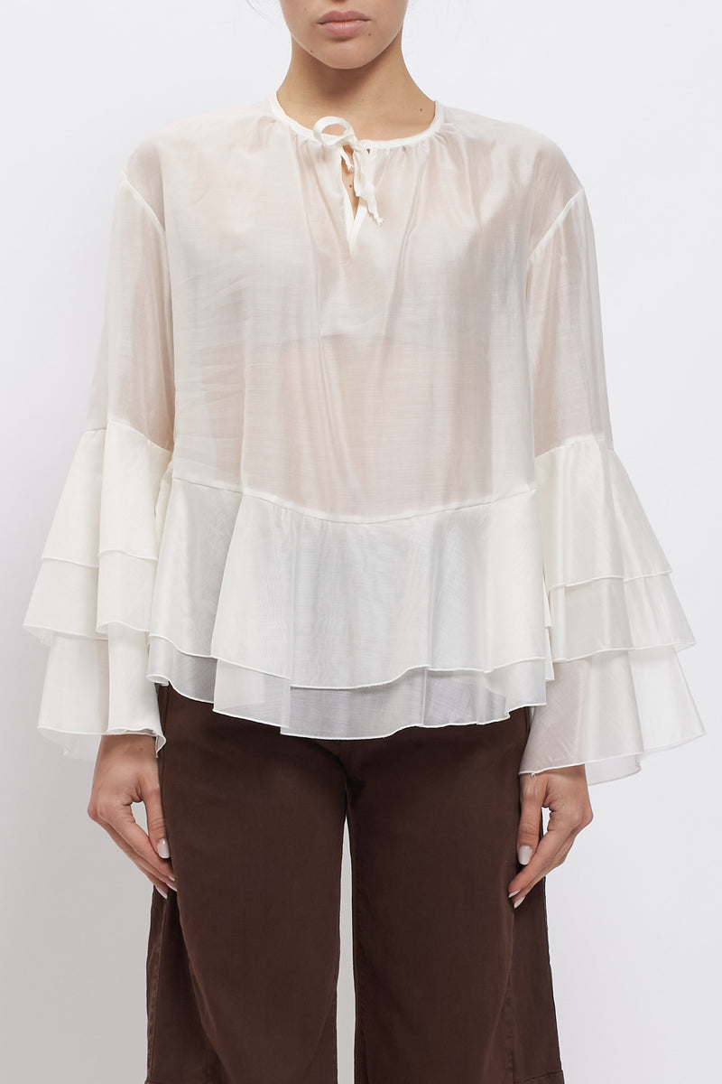 Blusa con maniche volant