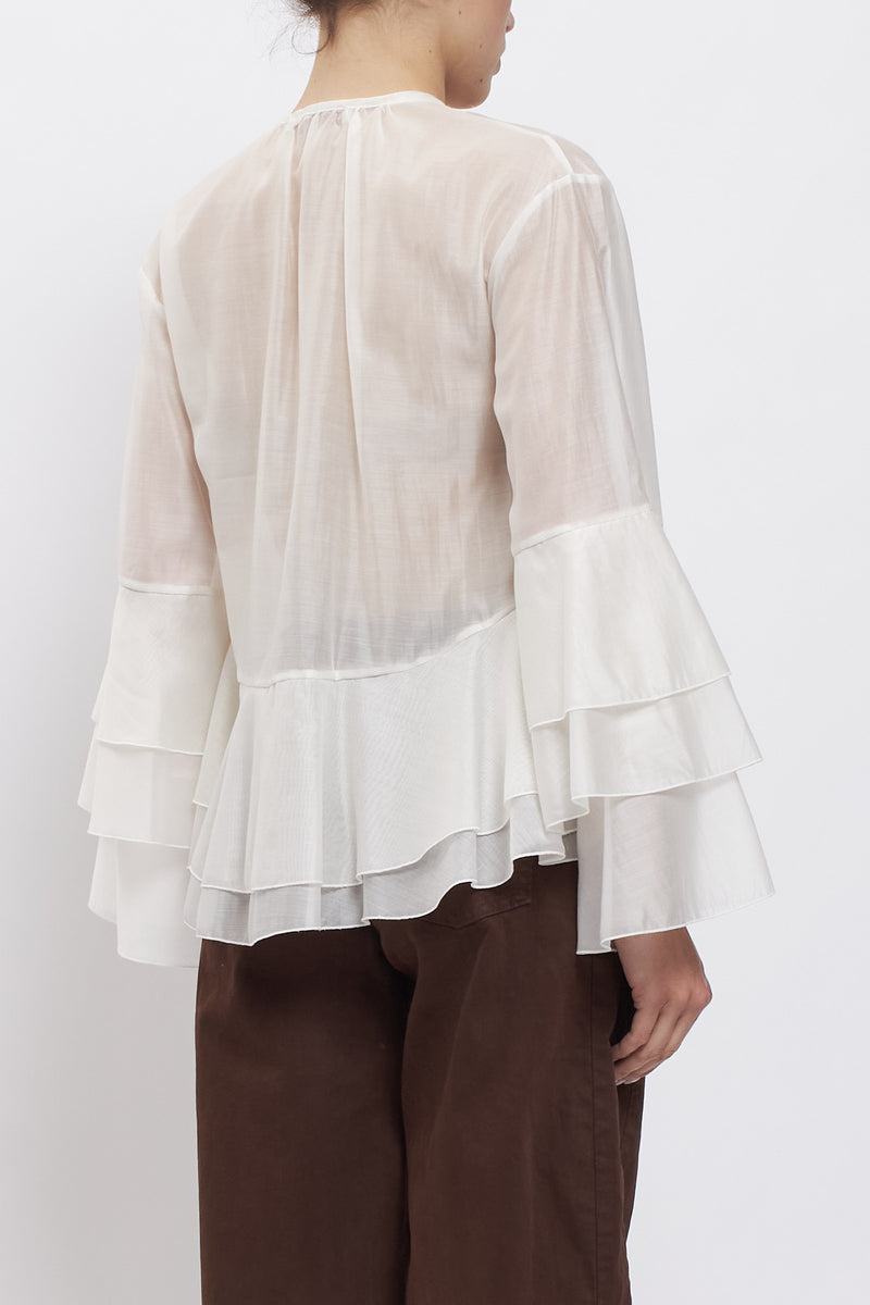 Blusa con maniche volant