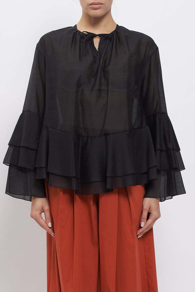 Blusa con maniche volant