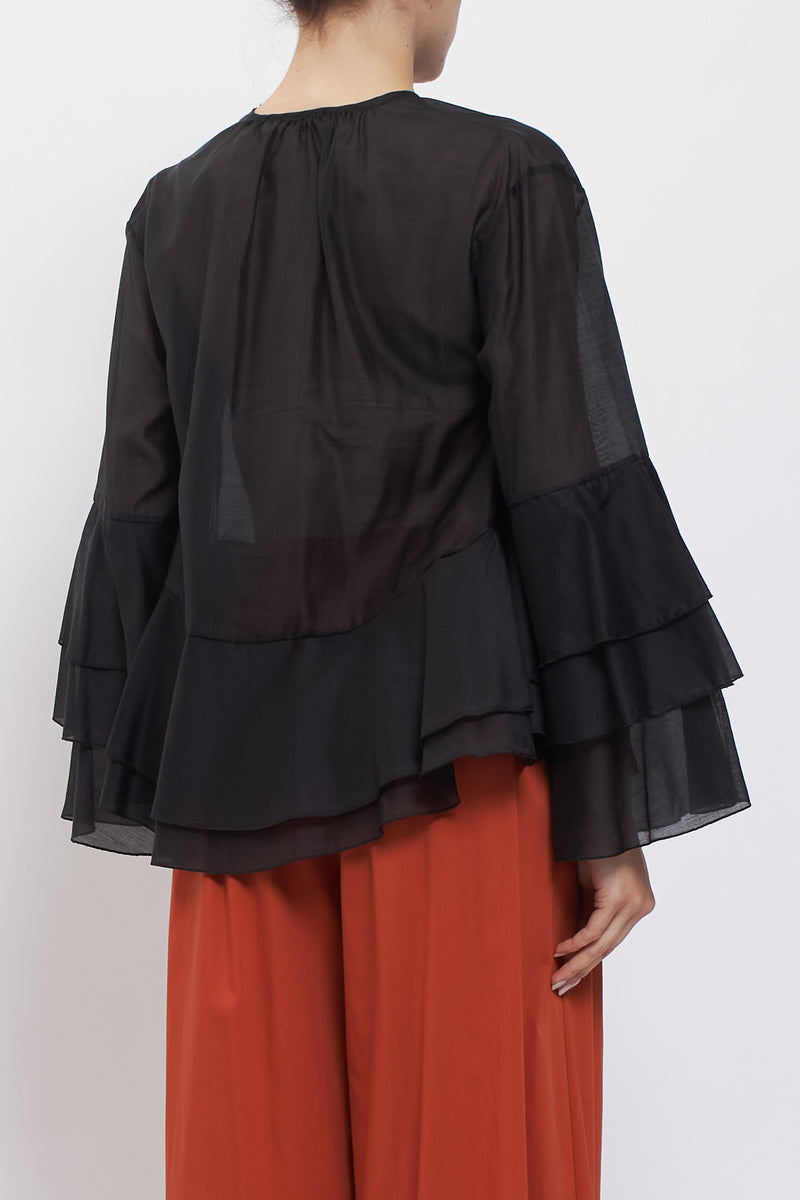 Blusa con maniche volant