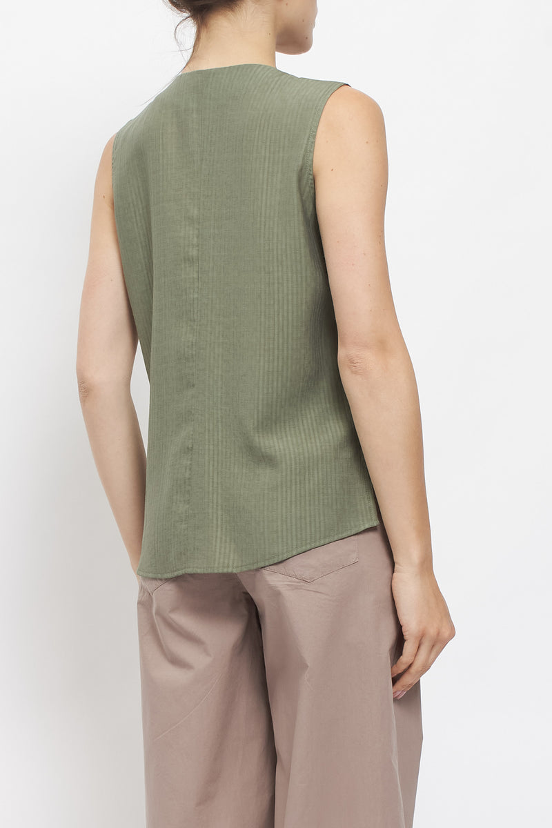 Top asimmetrico con taschino