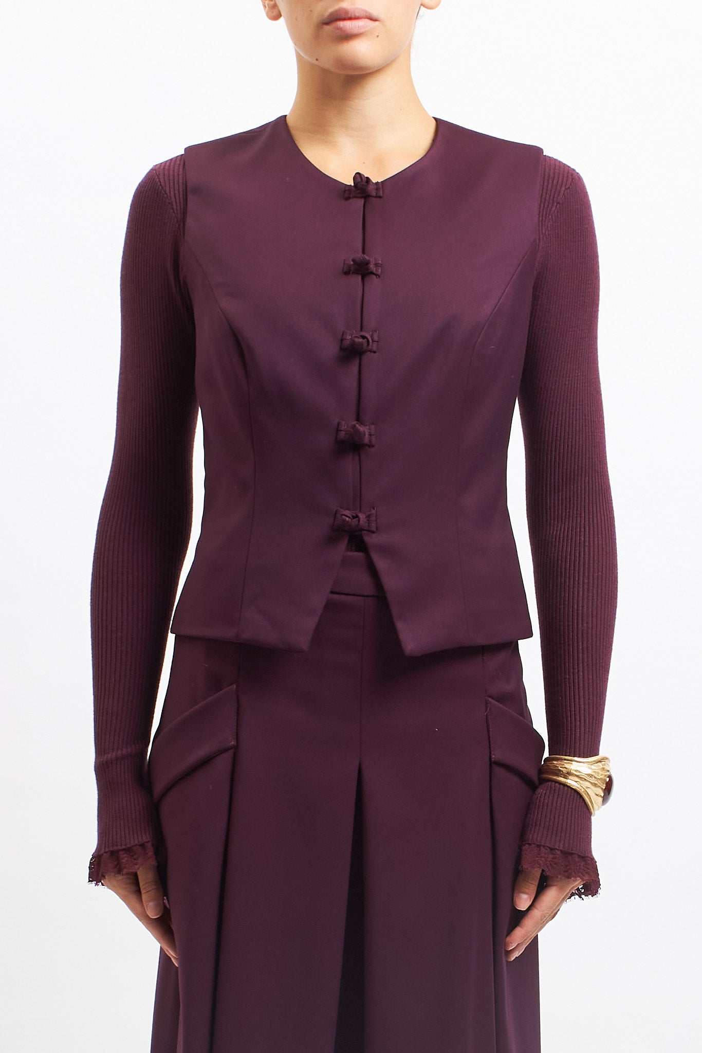 Gilet con alamari in tessuto