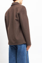 Cappotto corto asimmetrico con doppio bottone