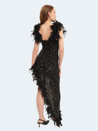 Abito lungo asimmetrico con piume e paillettes