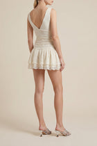 Mini abito in pizzo con balze