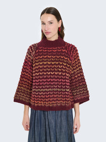 Maglione cuoricini con maniche a campana
