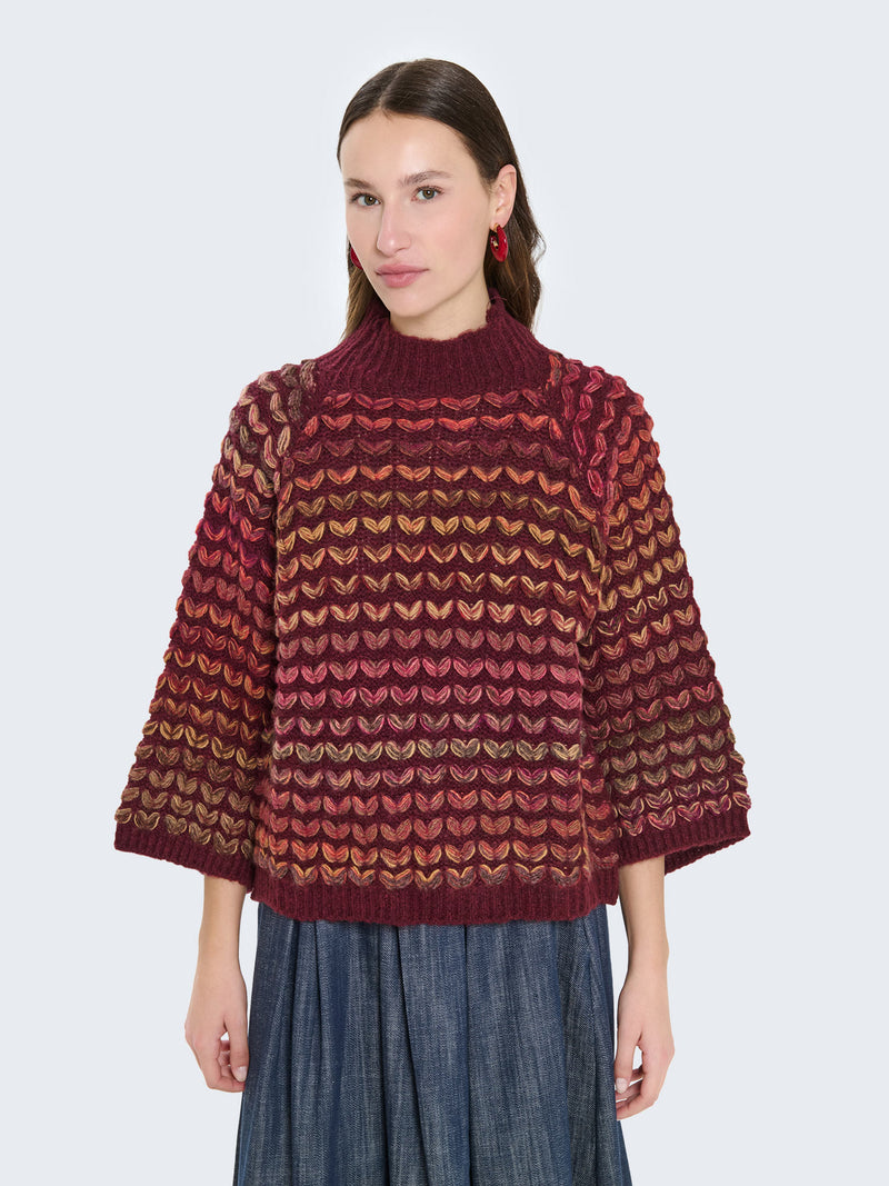 Maglione cuoricini con maniche a campana