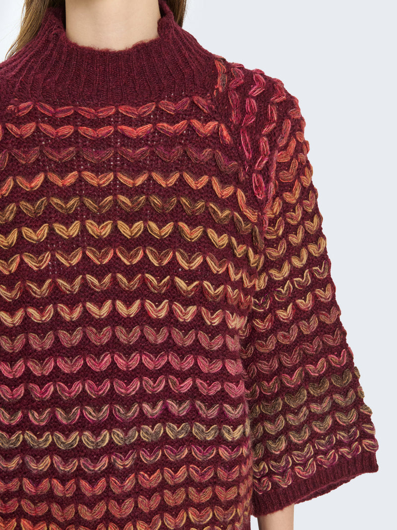 Maglione cuoricini con maniche a campana