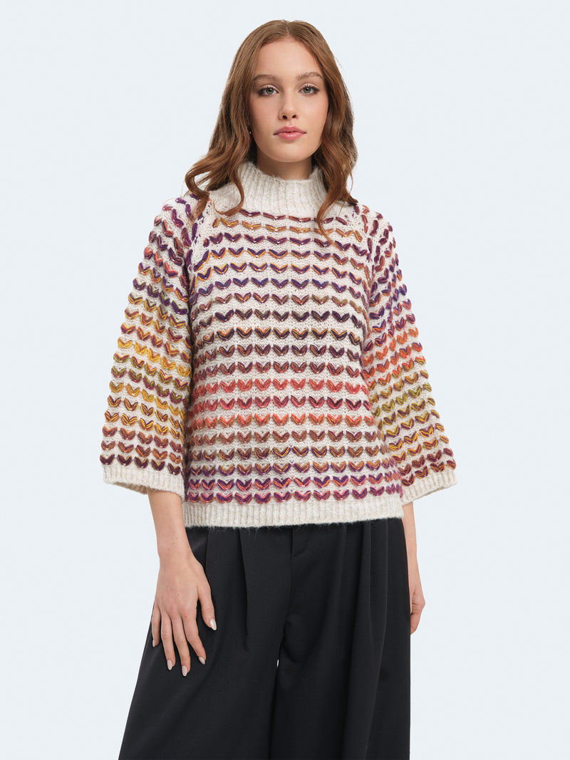 Maglione cuoricini con maniche a campana