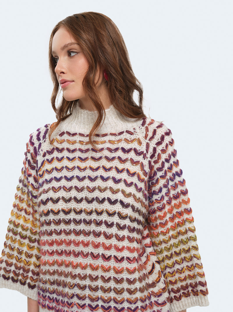 Maglione cuoricini con maniche a campana