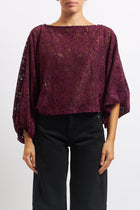 Blusa in pizzo con manica a palloncino