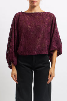 Blusa in pizzo con manica a palloncino