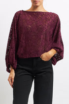 Blusa in pizzo con manica a palloncino
