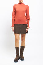Maglia con collo alto con polsini a costine