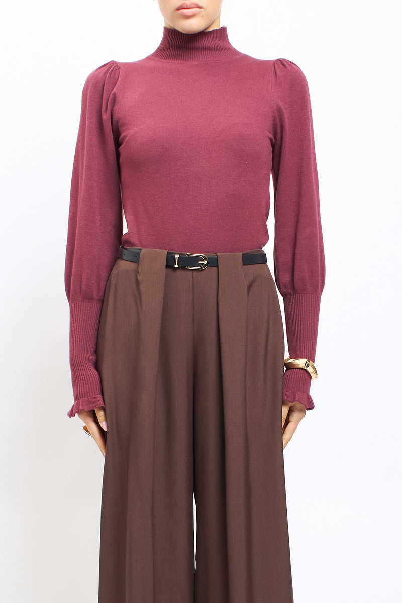 Maglia con collo alto con polsini a costine