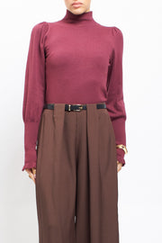 Maglia con collo alto con polsini a costine