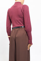 Maglia con collo alto con polsini a costine