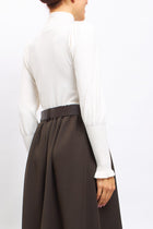 Maglia con collo alto con polsini a costine