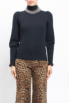 Maglia con collo alto con polsini a costine