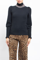 Maglia con collo alto con polsini a costine