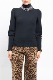 Maglia con collo alto con polsini a costine