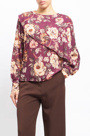 Blusa con fantasia floreale e volan