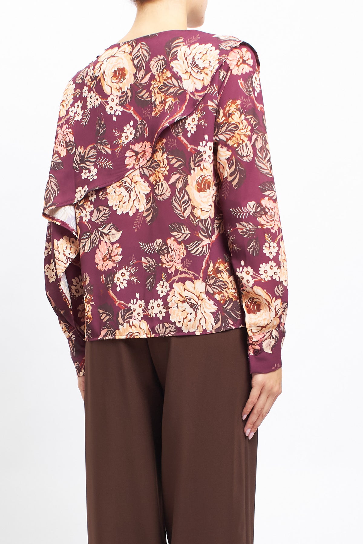 Blusa con fantasia floreale e volan
