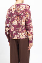 Blusa con fantasia floreale e volan