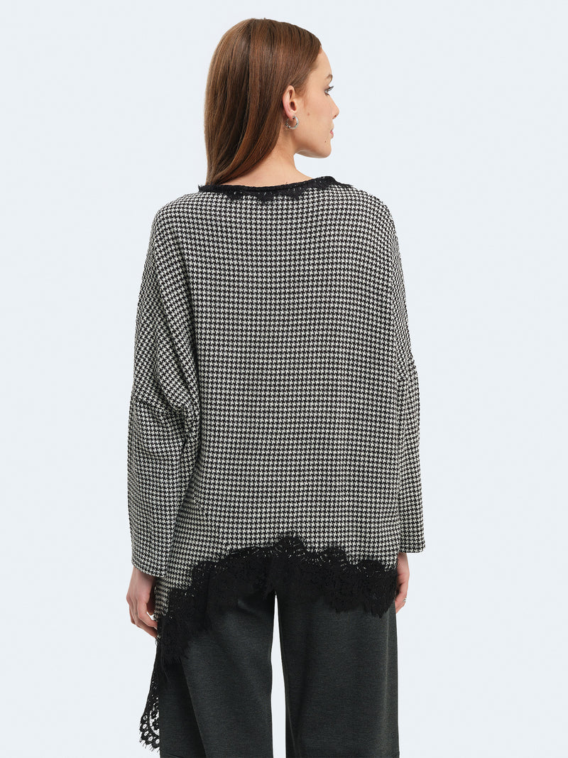 Maglia asimmetrica pied de poul con pizzo