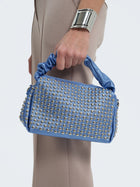 Borsa laminata con borchie