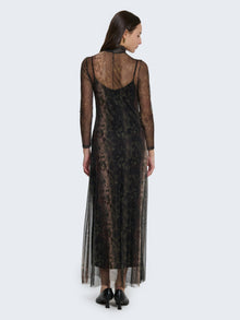 Tight-fitting dress with sheer details and jungle pattern