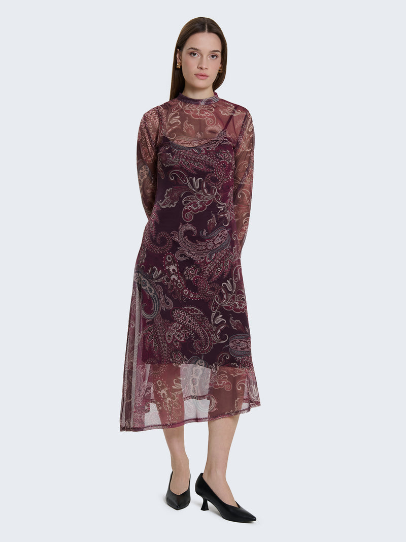 Abito aderente con trasparenze con fantasia paisley