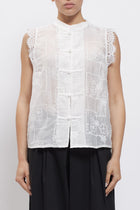 Camicia smanicata con nodi