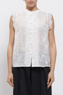 Camicia smanicata con nodi
