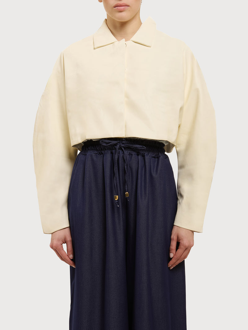 Giacca crop in ecopelle a maiche lunghe