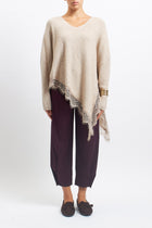 Maglia asimmetrica con inserti in pizzo