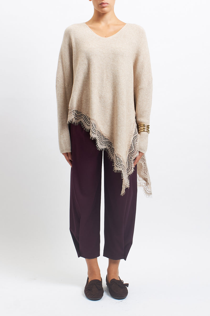 Maglia asimmetrica con inserti in pizzo
