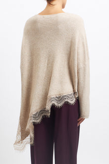 Maglia asimmetrica con inserti in pizzo