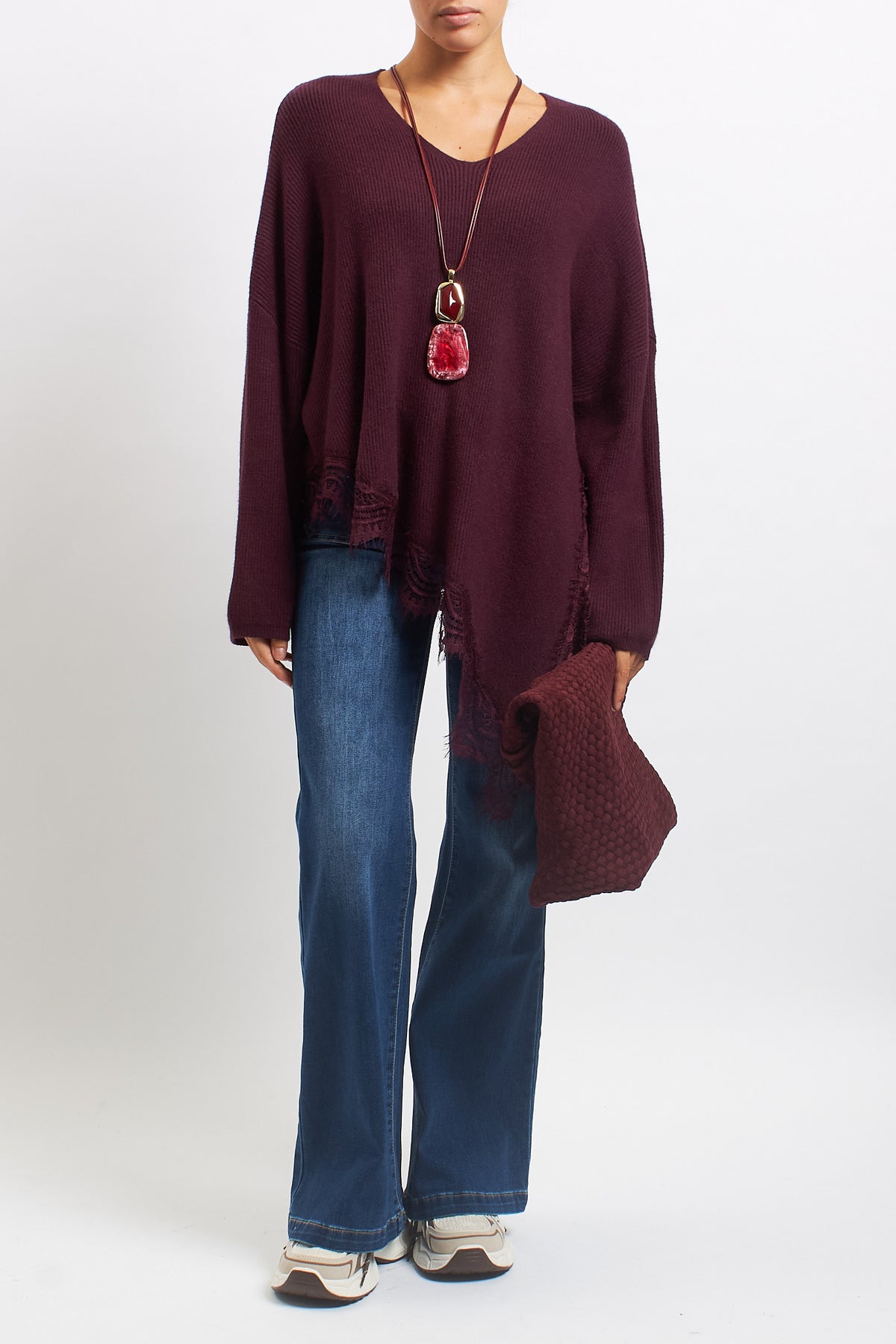Maglia asimmetrica con inserti in pizzo